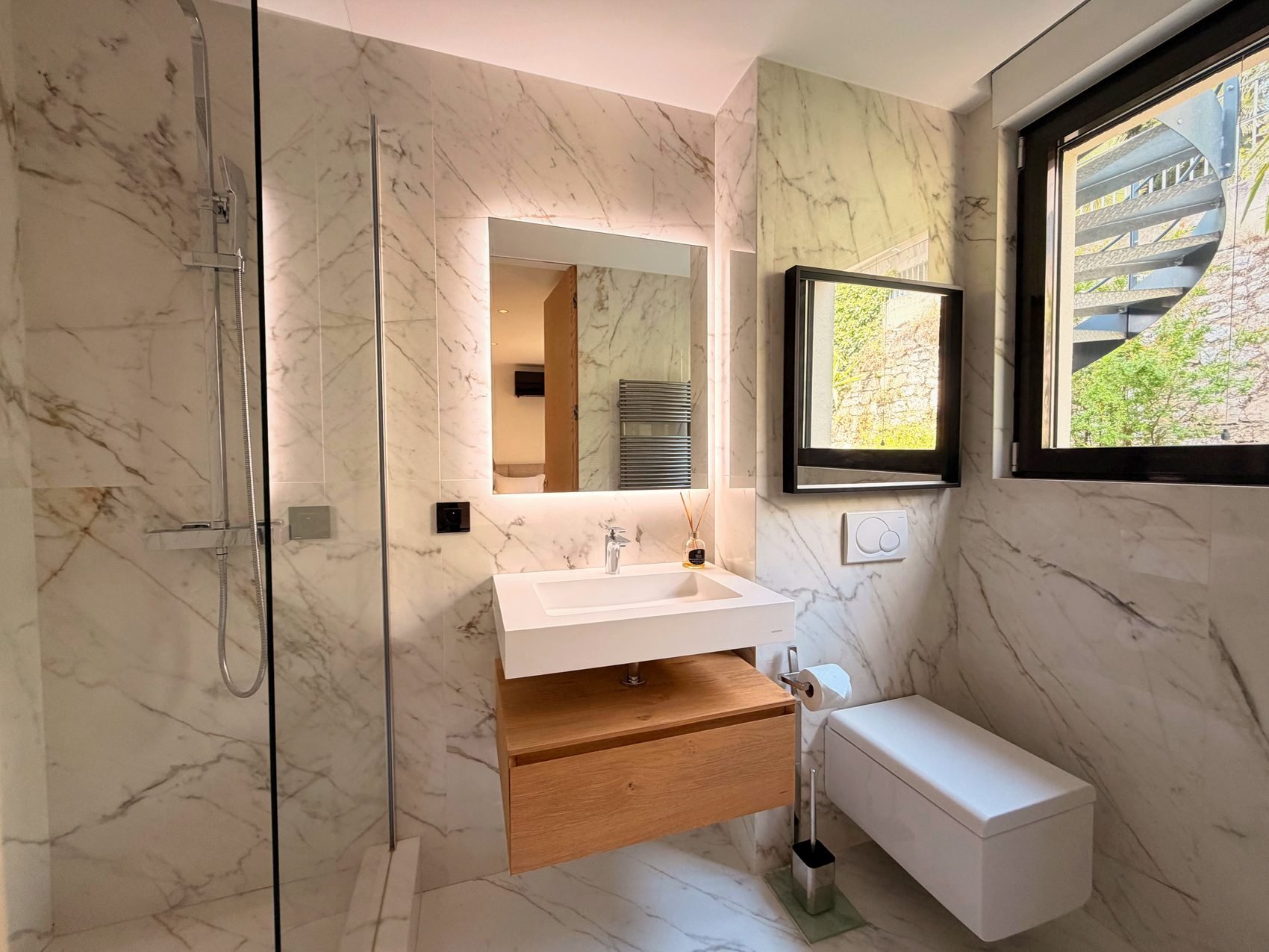 En-suite bathroom with a floating vanity