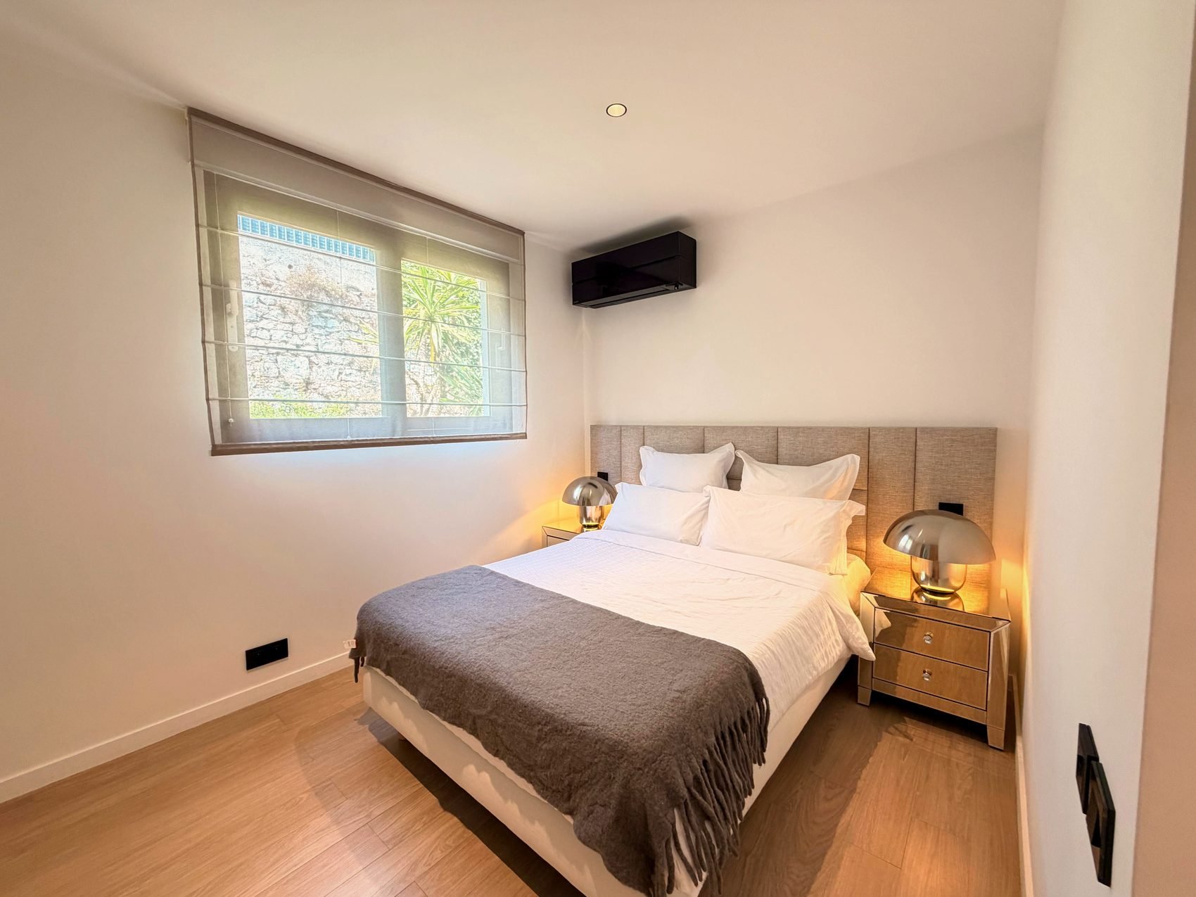 A second double bedroom in soft neutral tones